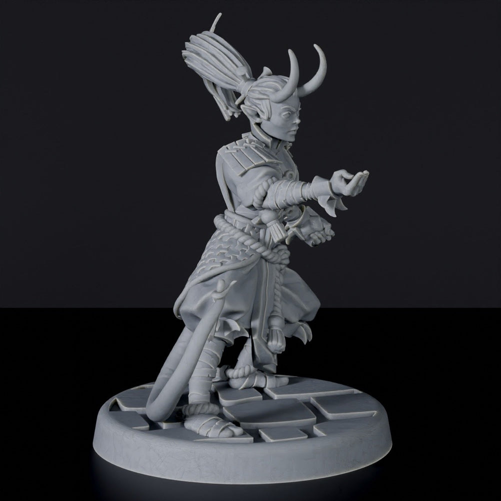 Tiefling Female Monk Holding Dagger with Tail