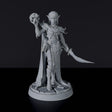 Miniature of Elf Female Warlock with sword and skull for fantasy tabletop role-playing games