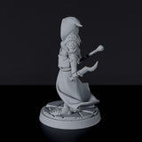 Miniature of Human Female Warlock with staff - dedicated magic set for fantasy tabletop roleplaying games and collectors