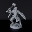 Miniature of Human Male Warrior with hammer, shield and armor for fantasy tabletop role-playing games