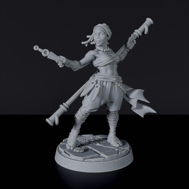 Miniature of Human Female Monk with knives and staff for fantasy tabletop role-playing games